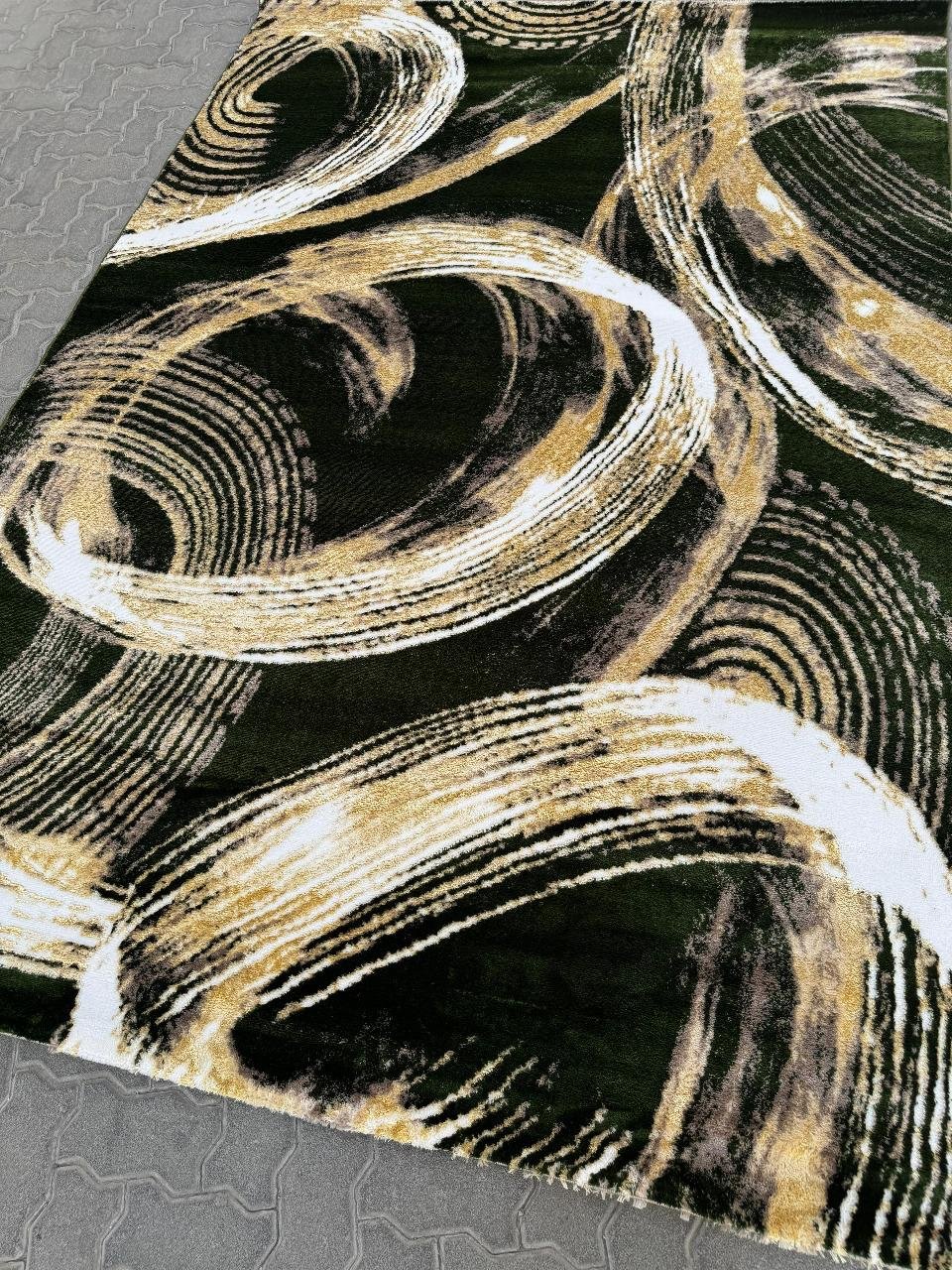 Golden Brushstroke Rug on Deep Green