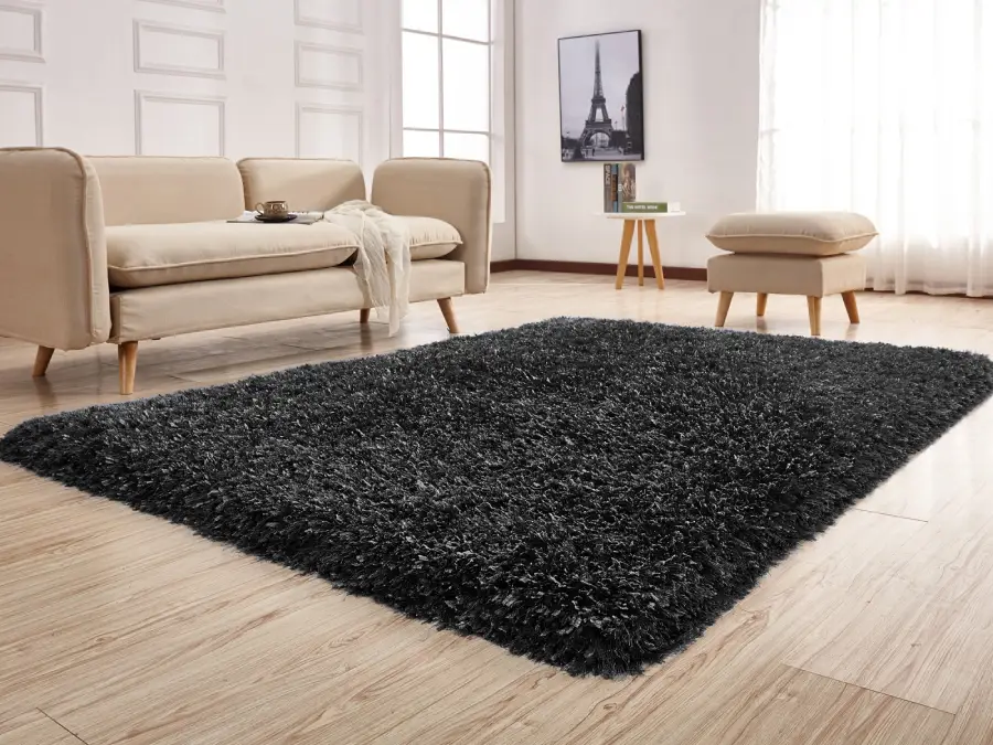 White and black wool rug with wooden sofa Dubai living room