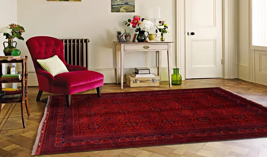 Red silk rug with an ivory floral border and cream fringe